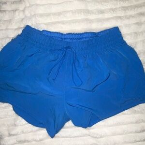 Blue Athletic Shorts with drawstring and small pocket. Size L.